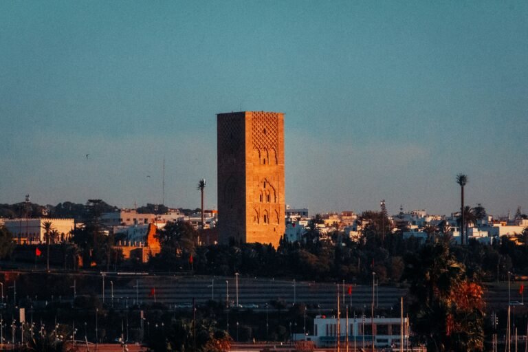 A stunning panoramic view of the rectangular Hassan Mosque minaret in Rabat Morocco travel. This iconic landmark showcases the beauty of historical architecture, making it a unique destination for heritage enthusiasts.