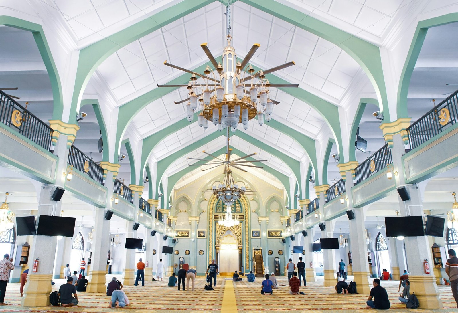 An image capturing the spirituality of Islam in Morocco, where worshippers perform their prayer in a Moroccan mosque after hearing the adhan in Morocco. The scene depicts a moment of reverence and community, as believers respond to the call of Allah Almighty. The mosque's design reflects Moroccan Islamic architecture, with traditional motifs and luxurious carpets. The photo captures the atmosphere of tranquility and submission that follows the adhan in Morocco, representing the deep connection of the Moroccan people to their faith and spiritual heritage.